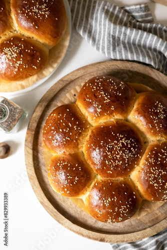 Homemade round breakfast buns with sesame seeds