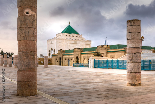 Rabat, Morocco - March 22, 2024: The Mausoleum of Mohammed V is a historical building located on the opposite side of the Hassan Tower on the Yacoub al-Mansour esplanade in Rabat, Morocco photo