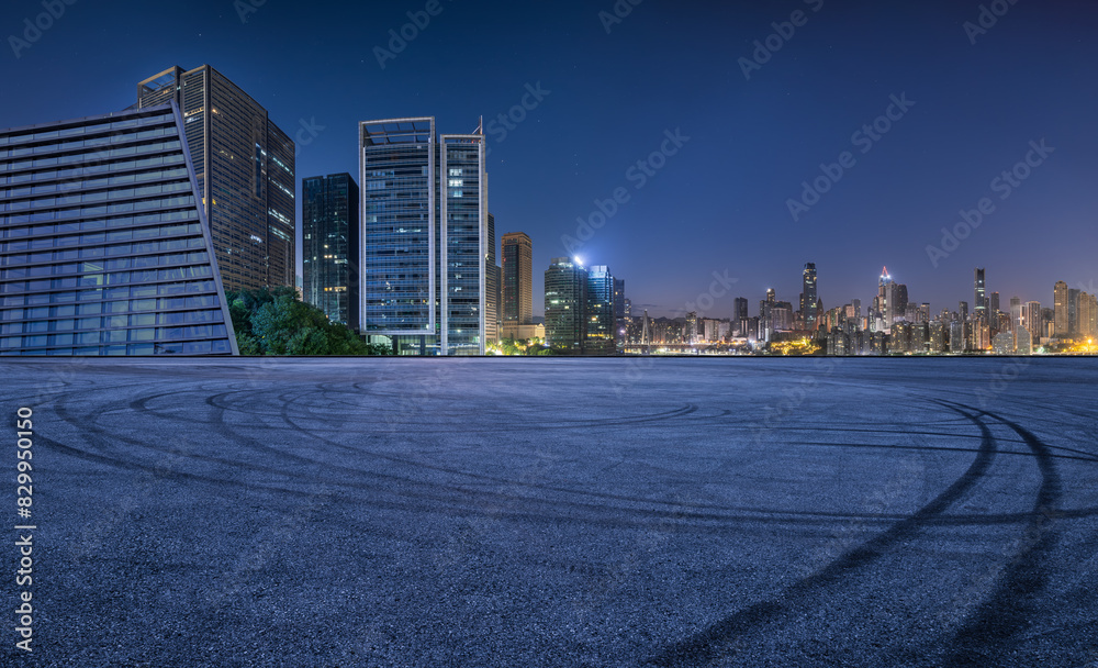 Asphalt road square and modern city buildings at night in Chongqing. Panoramic view.