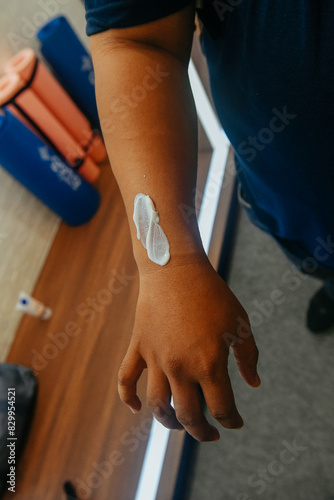 close up of asian man's hand applying lotion