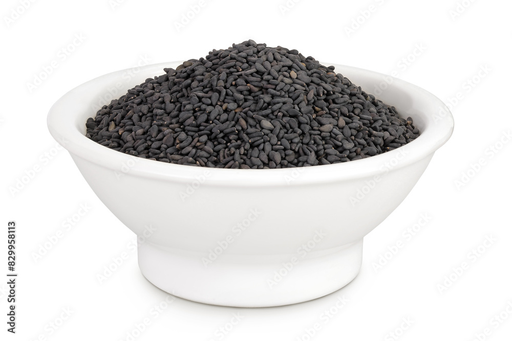 black sesame seeds in ceramic bowl isolated on white background with full depth of field