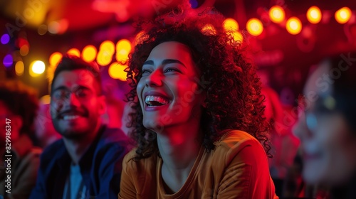 Happy woman laughing with friends at a live event.