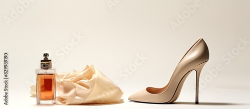 A beige high heeled shoe is seen in isolation against a white background The image has copy space and includes cosmetics and beauty products