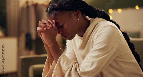 Black girl, worship or pray on sofa in home for solace or devotion, spiritual connection and wellness gratitude to god. Woman, eyes closed and prayer to higher power for praise or hope and christian.