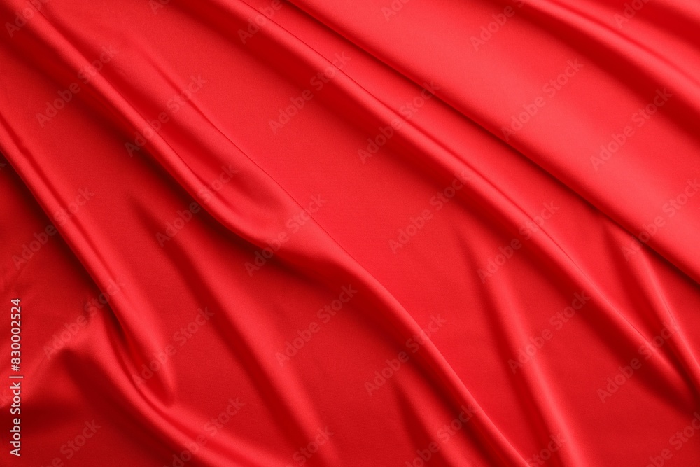 Crumpled red silk fabric as background, top view Crumpled red silk fabric as background, top view