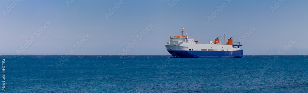 cargo ship in the middle of the sea, panorama,  banner