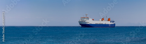 cargo ship in the middle of the sea, panorama,  banner