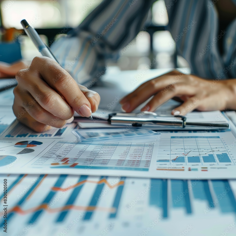 Business analyst checking in financial statement for audit internal control system. Accounting and Financial Concept Business analyst checking in financial statement for audit internal control system. Accounting and Financial Concept