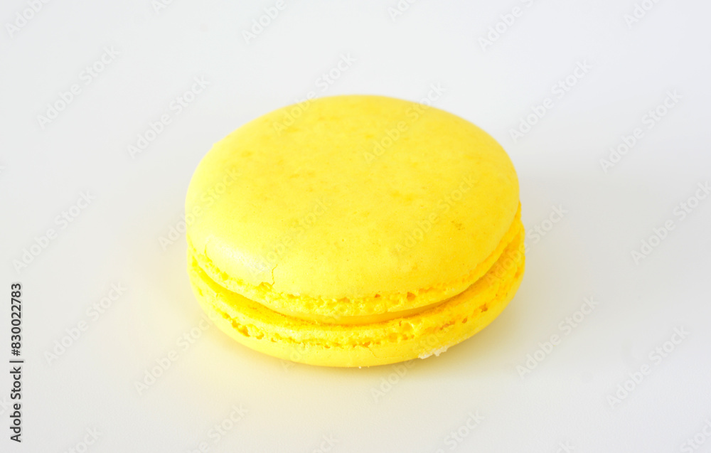 a yellow round cookie with a white background a yellow round cookie with a white background