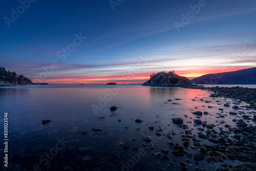 Whyte Islet at sunset, twilight, or dusk with pink and purple skies near Vancouver, Canada