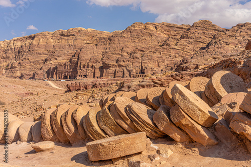 Earthquake-Toppled Columns in the Great Temple of Petra, Jordan: Historical Ruins Amidst Majestic Sandstone Cliffs