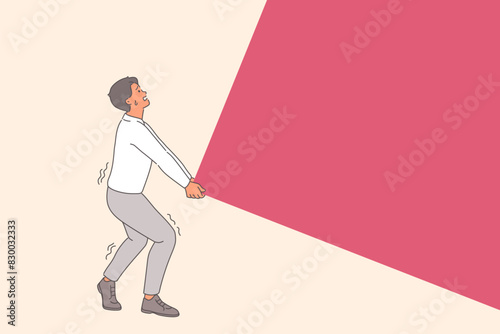 Business man is performing very difficult task, lifting large load or wall, and risking back injury