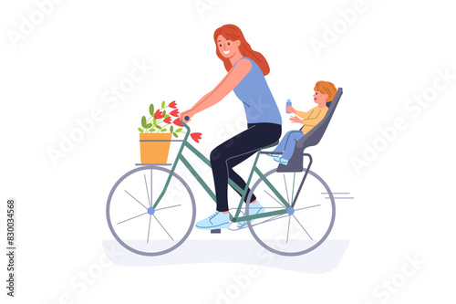 Mother rides bicycle with little son and enjoys opportunity for summer recreation in fresh air. Bicycle with place for baby behind driver, for young mothers leading active lifestyle