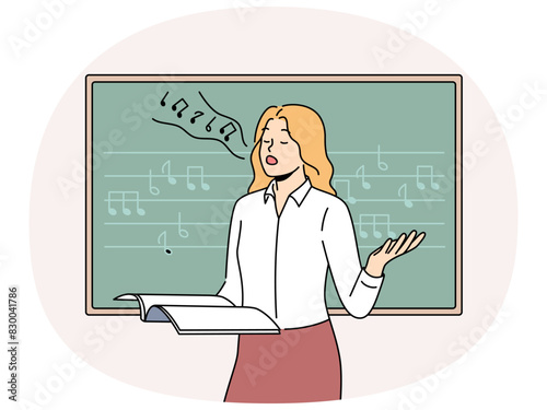 Woman vocalist sings standing near blackboard with notes and helping students develop voice. Girl holds magazine and sings wanting to become professional vocalist or audio composer
