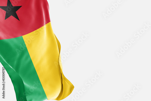National flag of Guinea Bissau flutters in the wind. Wavy Guinea Bissau Flag. Close-up front view.