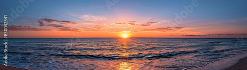 Sunset over the ocean, serene and breathtaking, vibrant colors, tranquil and peaceful, natural beauty, beach landscape, clear horizon, copy space.