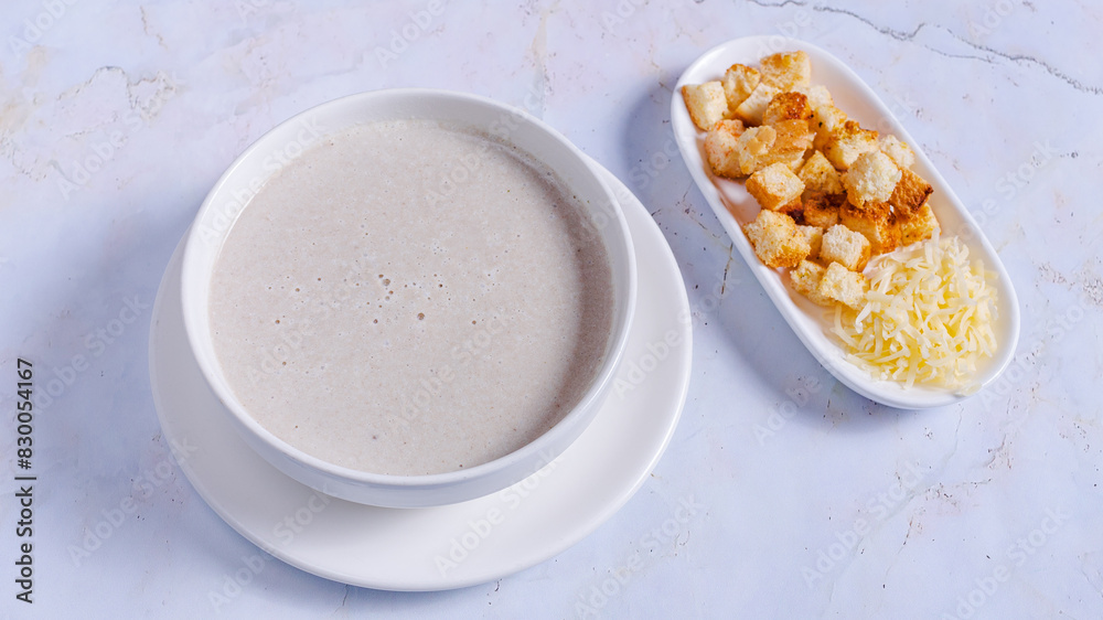 Mushrooms creamy soup bowl isolated