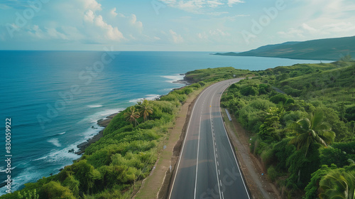 Magazine photography, aerial photography. Beautiful shot of a coastal highway in tropical countryside. Shot at noon in the summertime. Drone photo