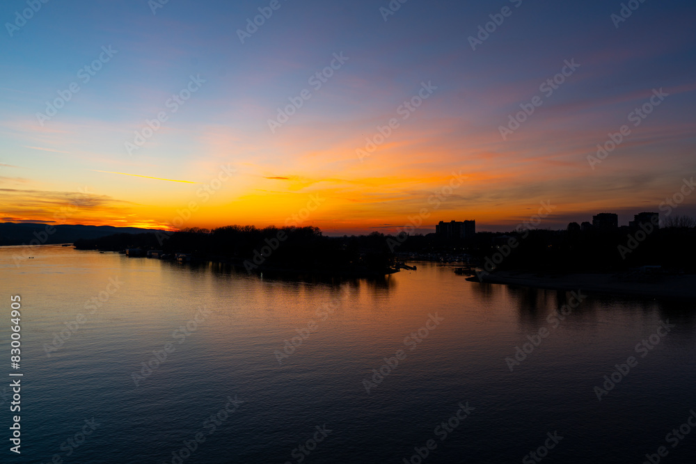 Tranquil sunset over Danube river in Novi Sad, Serbia in winter evening