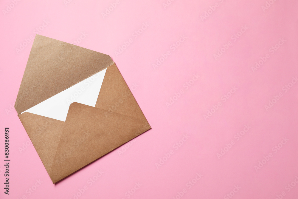 Letter envelope with card on pink background, top view. Space for text Letter envelope with card on pink background, top view. Space for text