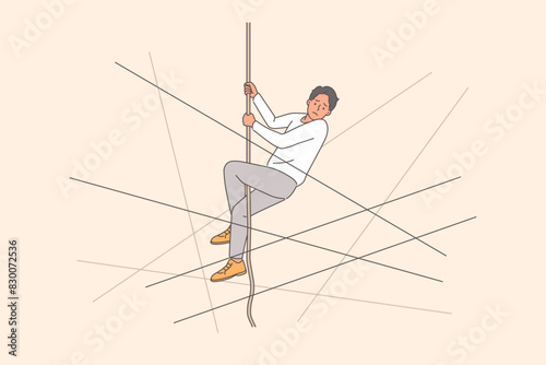 Man climbing up rope wants to find escape from difficult life situation or career dead end