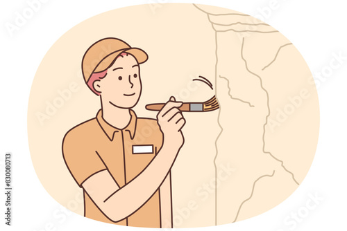 Male archeologist working at excavation site