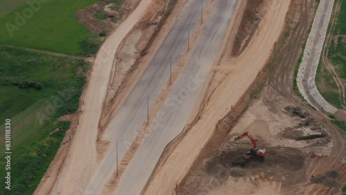 Romania A1 highway construction site. Aerial 4k video of A1 road that connects Bucharest Pitesti highway with Curtea de Arges and Sibiu. Infrastructure construction industry in Romania. photo