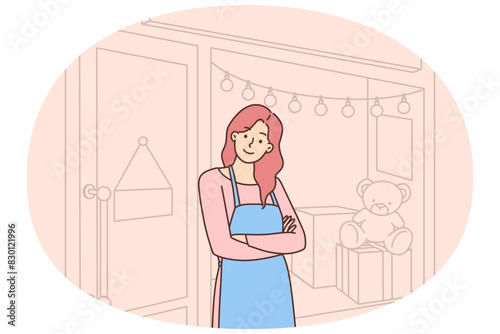 Smiling female shop owner near store