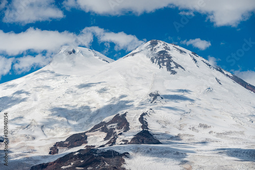 Snowy peak of Mount Elbrus in spring. Caucasus mountains. Kabardino-Balkaria Reublic. Panorama of Elbrus.