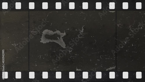Damage to an old celluloid film strip. Tearing. Burning. Transition. Glitches. Overlay.