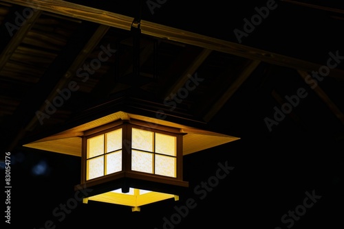 Close-up of illuminated lantern glowing at dusk - warmth - illumination - peaceful night photo