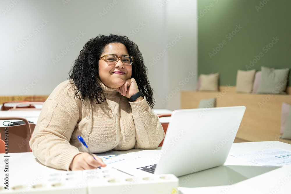 Contemporary coworking space with a smiling person Contemporary coworking space with a smiling person