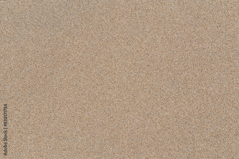 Smooth untouched fine sand on a beach on a sunny day, viewed from above. Abstract textured natural sandy background, top view. Copy space. Smooth untouched fine sand on a beach on a sunny day, viewed from above. Abstract textured natural sandy background, top view. Copy space.