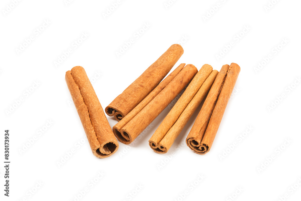 Cinnamon sticks isolated on white background. Cinnamon roll. Spicy spice for baking, desserts and drinks. Fragrant ground cinnamon. Cinnamon sticks isolated on white background. Cinnamon roll. Spicy spice for baking, desserts and drinks. Fragrant ground cinnamon.