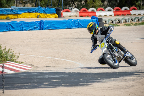Motorcycle Racer on Track Cornering (ID: 830188194)
