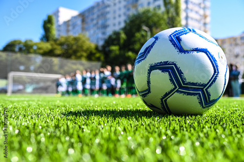 Obraz na płótnie children's football match on an artificial field w salonie