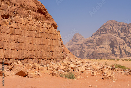 Lawrence’s House in Wadi Rum, Jordan: Historical Ruins Amidst Majestic Sandstone Mountains and Desert Landscape photo