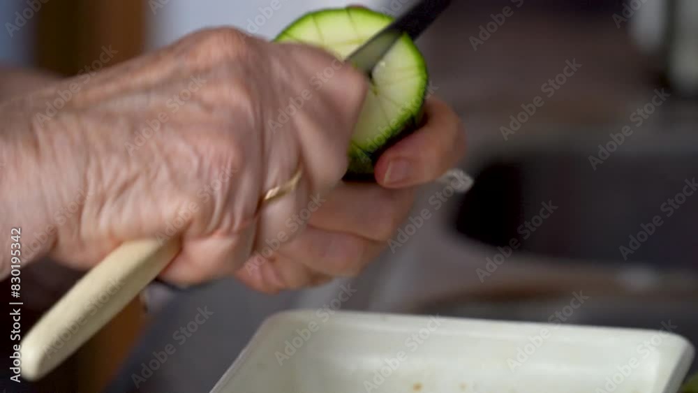 Closeup, unrecognizable person chopping and fresh zucchini. Real time video. Closeup, unrecognizable person chopping and fresh zucchini. Real time video.