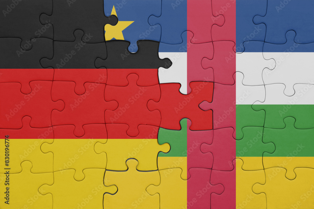 puzzle with the colourful national flag of central african republic and flag of germany. puzzle with the colourful national flag of central african republic and flag of germany.