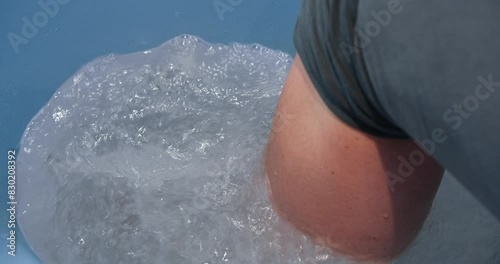 lower limb whirpool bath | rehabilitation massage | close-up shot of a detail from the back photo