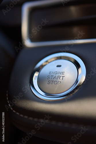 The image displays a detailed view of a cars startstop button photo