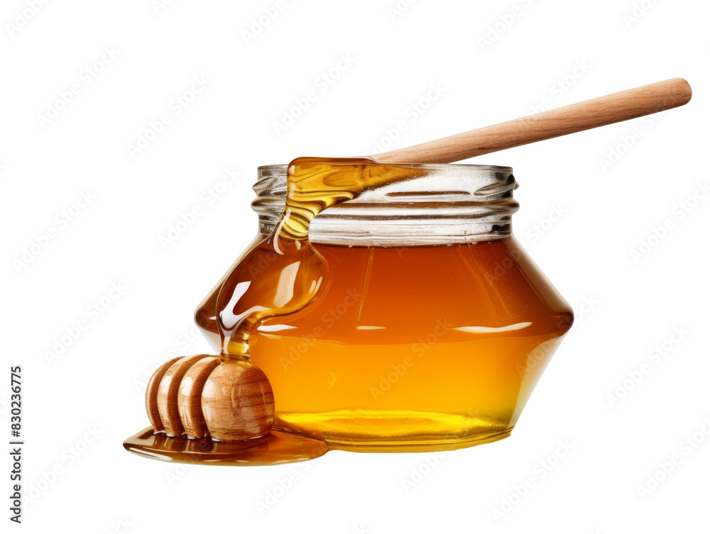 A glass jar of honey with a wooden dipper and a honey dipper on a wooden base. The honey is dripping from the dipper and the jar. A glass jar of honey with a wooden dipper and a honey dipper on a wooden base. The honey is dripping from the dipper and the jar.