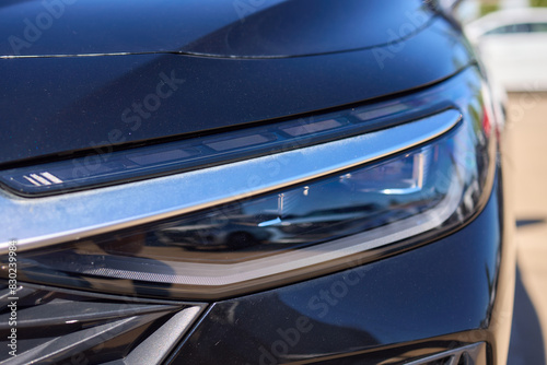 Close up of a cars headlight, part of automotive design © Евгений Вершинин