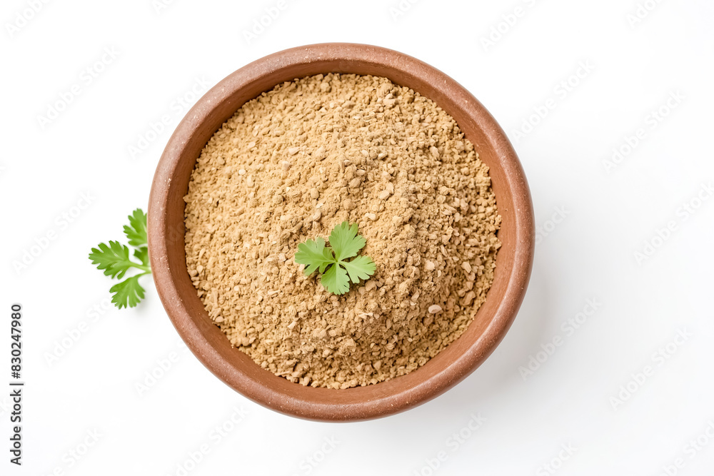 Ground ginger in a bowl with a green leaf Ground ginger in a bowl with a green leaf