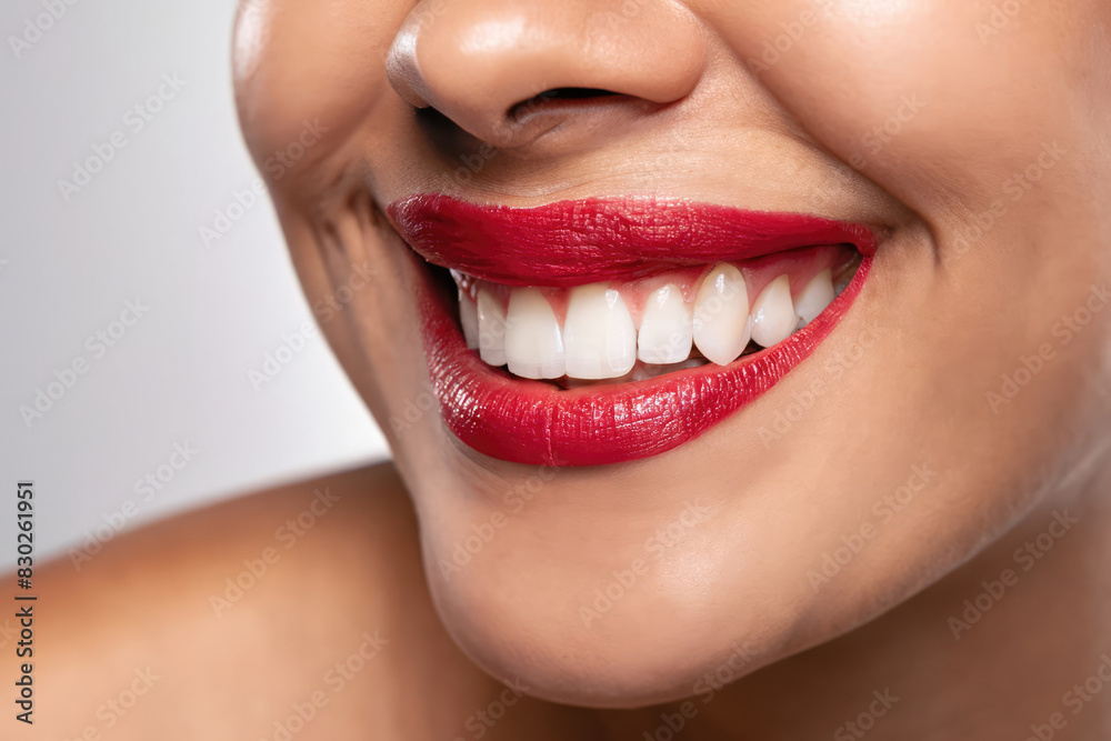 Fototapeta premium close up of a woman smiling, perfect teeth of a woman, dental care, advertising for whitening