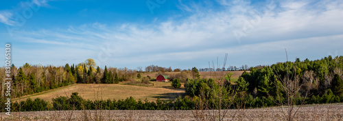 Wisconsin farmland with red barn in April