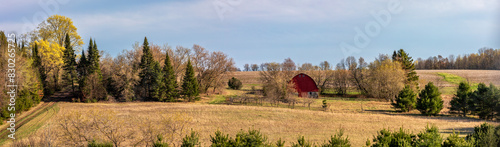 Wisconsin farmland with red barn in April