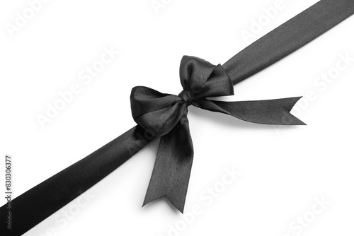 Black satin ribbon with bow isolated on white, top view