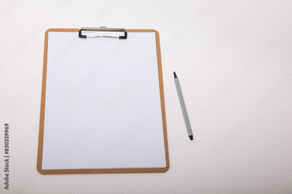 Wooden clipboard with blank white paper mock up with a pen Wooden clipboard with blank white paper mock up with a pen