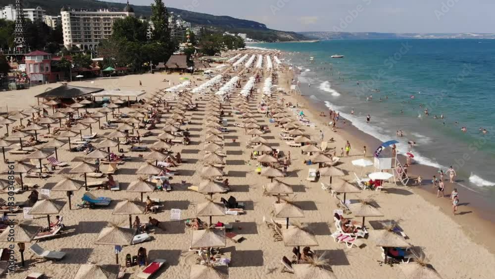 Aerial view of the beach and hotels in Golden Sands, Zlatni Piasaci. Popular summer resort near Varna, Bulgaria. Drone view from above. Summer holidays destination
